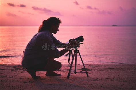 Woman Photographer Takes A Picture Of A Mountain Landscape On The