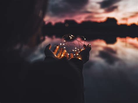 Person Holding Lighted Fire During Nighttime Hd Phone Wallpaper Peakpx