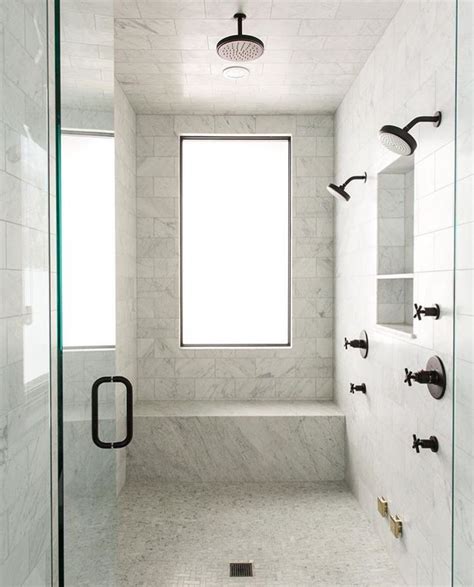 We hope you enjoy these carefully selected products we recommend. White marble shower with matte black plumbing fixtures ...