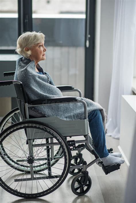 upset mature woman sitting in wheelchair in room stock image image of chair despond 109208353