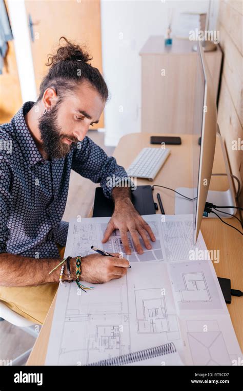 Young Architect Working At Home With Blueprints Stock Photo Alamy