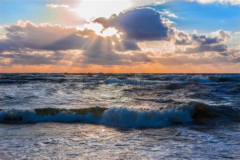 Sunset In The Cloudy Sky Over The Stormy Sea Stock Photo Image Of