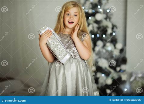 Merry Christmas And Happy Holiday Pretty Blonde Girl With Long Hair Is