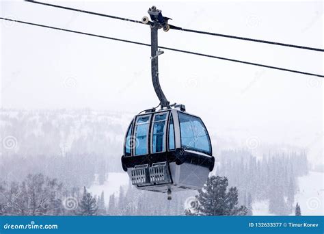 Ski Lift On Cable Car With A Closed Cabin With Blue Mirrored Glass On The Background Stock Image