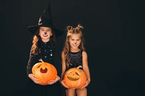 Free Photo Group Of Girls Dressed In Halloween Costumes In Studio