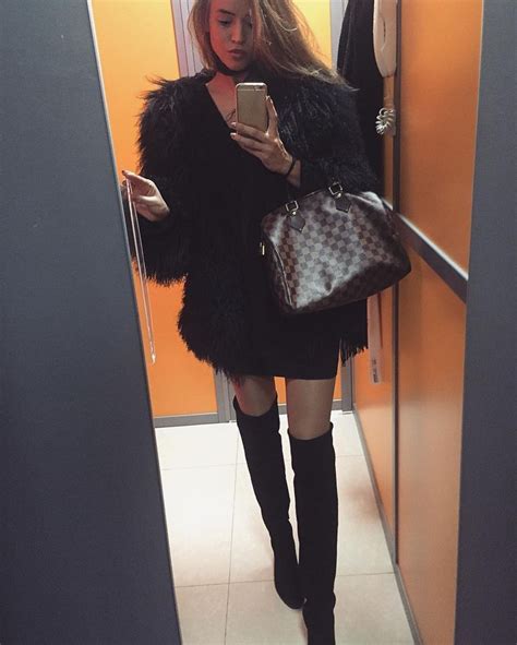 Mirror Selfie Of Black Thigh High Boots On Tan Pantyhose With Short