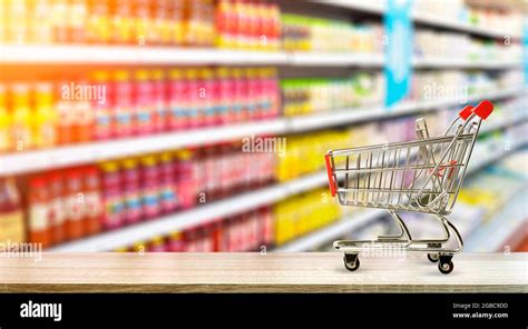 Supermarket Grocery Table Background With Cart Food And Groceries