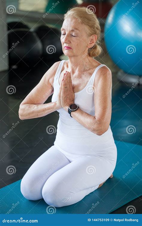 Senior Woman Doing Yoga In Fitness Gym Aged Lady Exercising Old