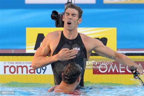 us swimmer michael phelps and serbia s milorad cavic react after the news photo getty images