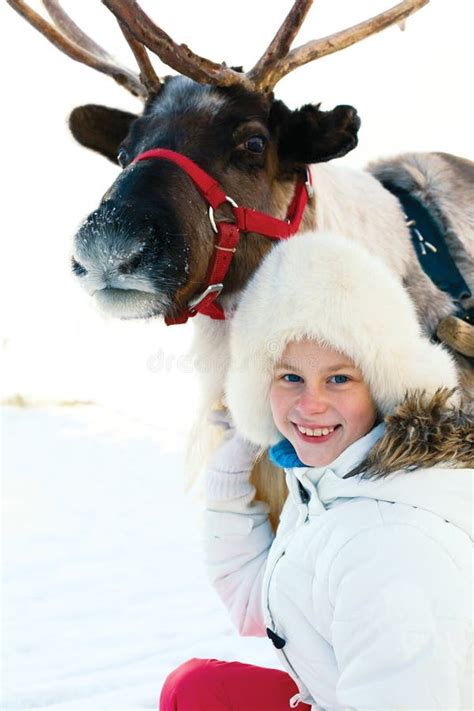 Happy Little Girl Hugging Her Reindeer Winter Playtime Stock Photo