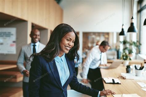 Smiling African American Businesswoman Sitting Down For An Office