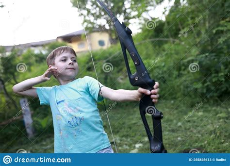 Boy Shooting Bow In Park Stock Image Image Of Concentration 255825613