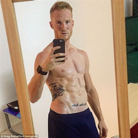 Greg Rutherford Flashes Perfectly Sculpted Washboard Abs Daily Mail Online