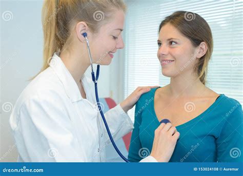 Doctor Listening To Patient S Chest With Stethoscope Stock Photo