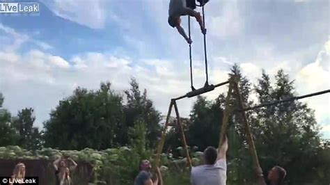 Russian Man Flies Off Swing And Smashes Into Fence Daily Mail Online
