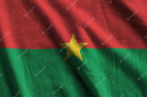 Premium Photo Burkina Faso Flag With Big Folds Waving Close Up Under