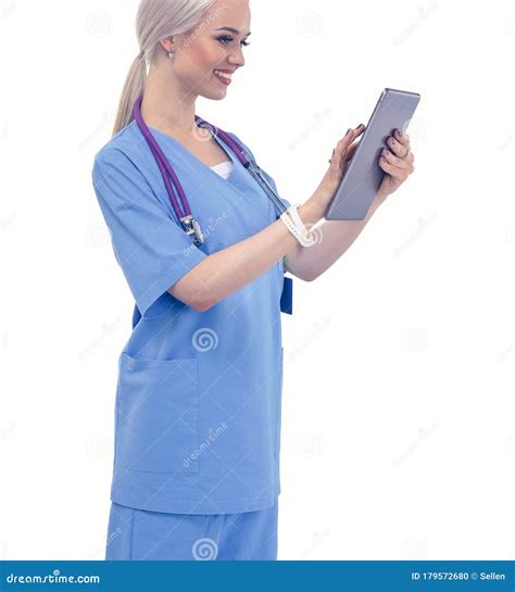 Female Doctor Using A Digital Tablet And Standing On White Background