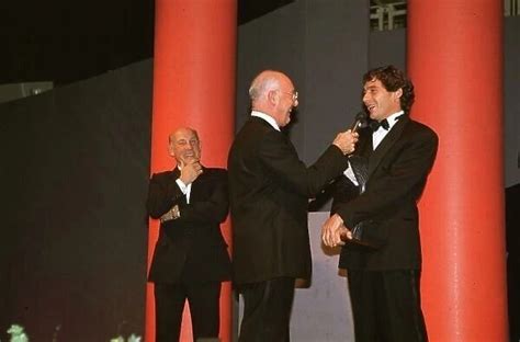 Ayrton Senna Receives His Award From Murray Walker In 1991