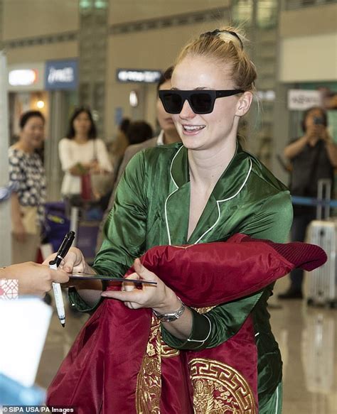 Sophie Turner Dons Green Silk Pajamas As She And X Men Crew Touch Down