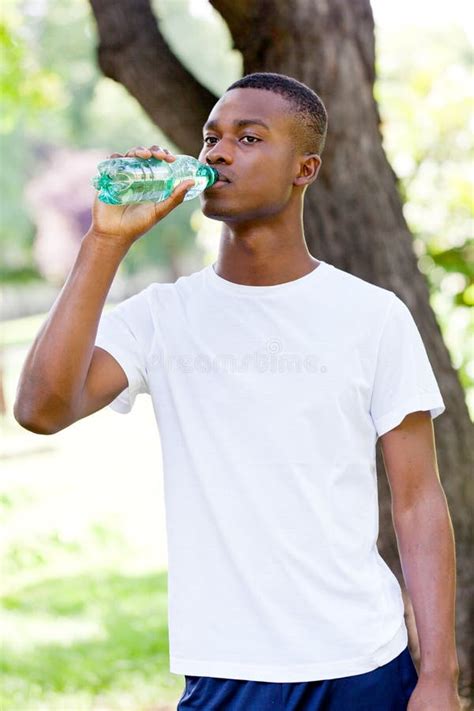 Athletic African Young Man Drinking Water Outdoor Stock Photo Image