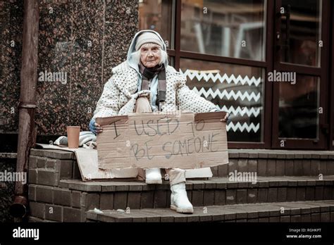 Unhappy Depressed Homeless Woman Holding A Sign Stock Photo Alamy