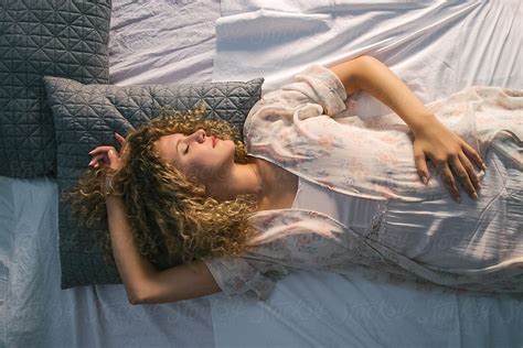 Beautiful Blond Woman Sleeping In Bed Del Colaborador De Stocksy