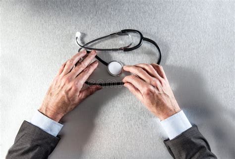 Healthcare Professional Hands Holding Stethoscope For Symbol Of