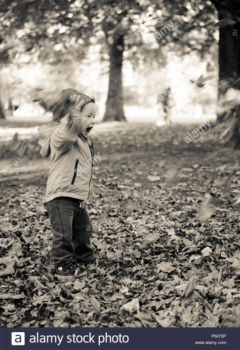 Children Throwing Autumn Leaves Hi Res Stock Photography And Images Alamy