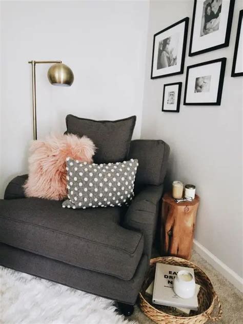 A Couch With Pillows And Pictures On The Wall