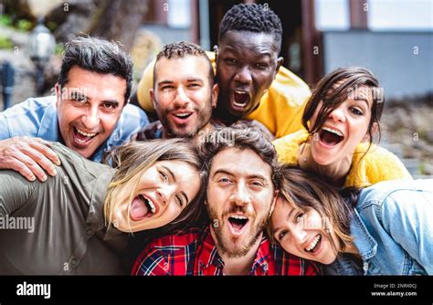 Multicultural Men And Women Taking Selfie Outdoors On Funny Party Mood Mixed Age Range Life