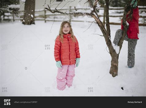 Young Girls Standing In The Snow Stock Photo Offset