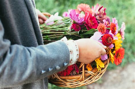 Girl Carrying Basket Of Fresh Picked Flowers By Deirdre Malfatto