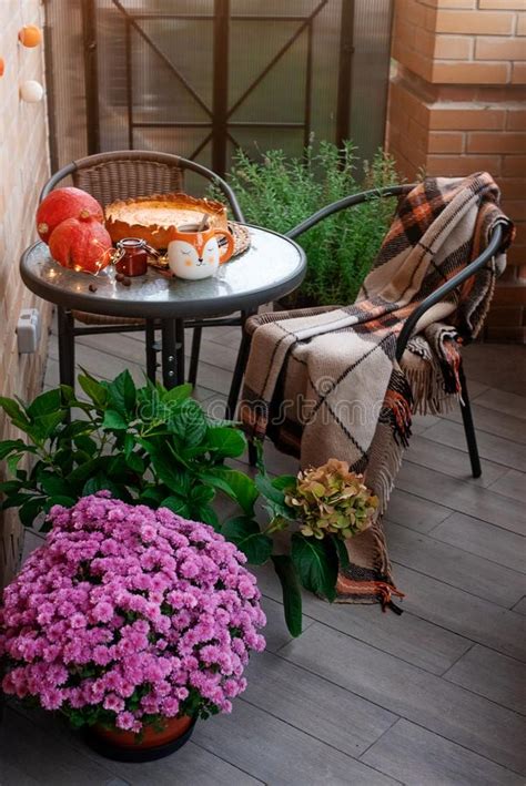 When it is about high profile events we have the skilled team of florist to take care of it. A Cozy Autumn Dinner On The Balcony Among Flowers And ...