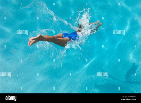 Young Woman Diving Into Swimming Pool Stock Photo Alamy