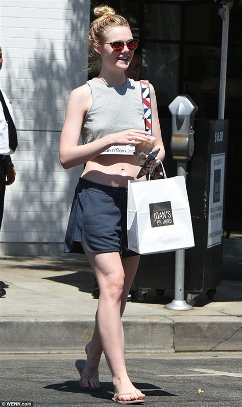 Elle Fanning Flashes Her Toned Tummy In Crop Top For Lunch Outing