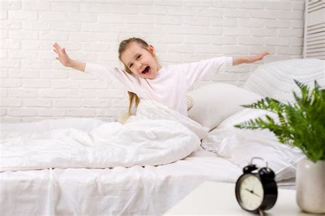 Little Child Girl Wakes Up From Sleep Stock Photo Image Of Human