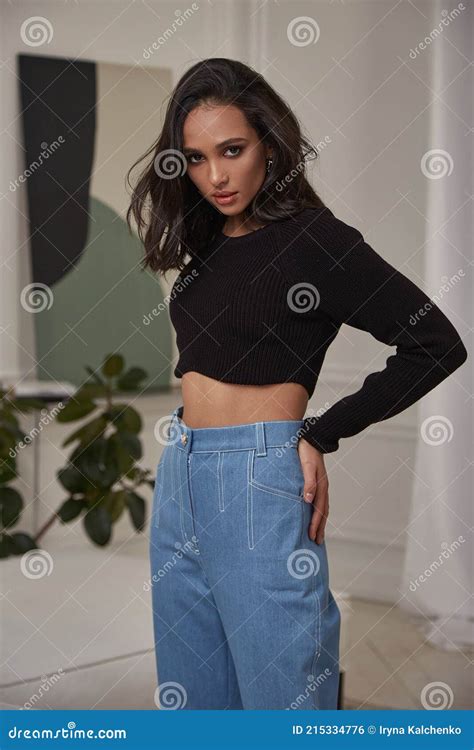 fashion beautiful model pretty lady dark tanned skin woman brunette hair wear denim jeans