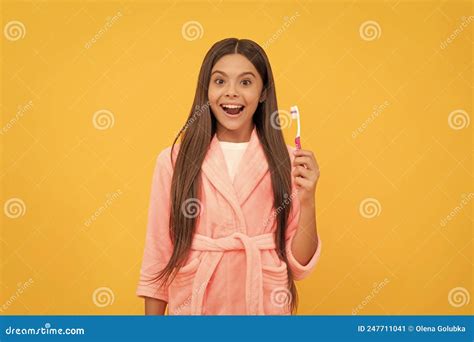 Surprised Teen Girl In Home Terry Bathrobe Hold Toothbrush Mouth Care