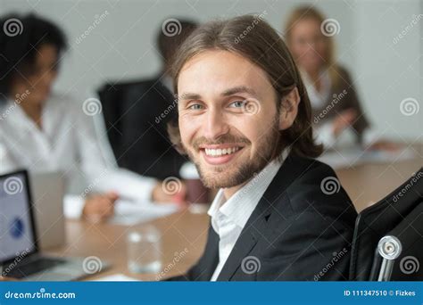 Smiling Attractive Young Businessman In Suit Looking At Camera Stock