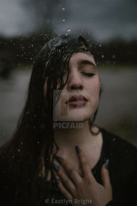 Young Woman Out In The Rain With Soaking Wet Hair License Download