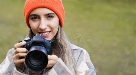 Happy Smiling Cute Girl With Camera Young Woman Takes Photo Outdoors
