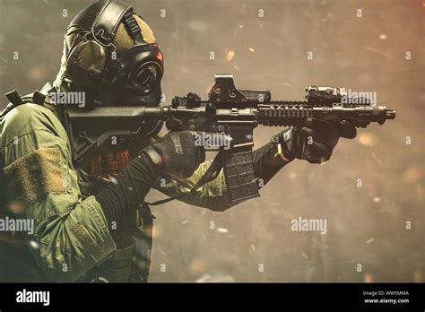 Elite Special Unit Soldier With Gasmask Is Holding Assault Rifle And