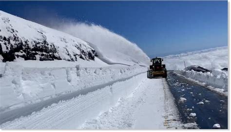 After Winter Storm Crews Clear Snow Drifts Up To 10 Feet High From