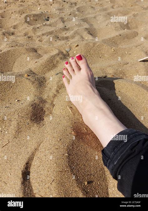 Sand Between Her Toes Woman S Foot On A Beach Stock Photo Alamy