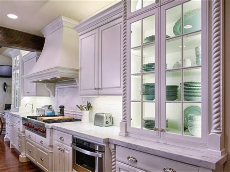 The open grate design allows for ventilation and the concealment of appliances. Glass-Front Cottage Style Kitchen Cabinet | HGTV