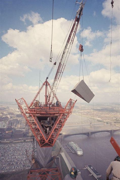 The Crane Is Being Lowered Into The Air