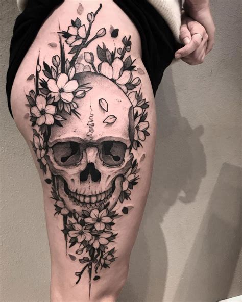 Skull And Flowers On Girls Thigh Best Tattoo Ideas For Men And Women
