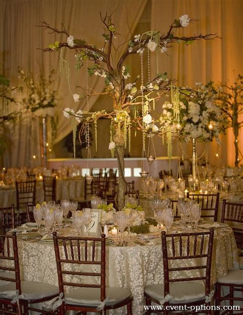 Tree Branch Centerpiece With Delicate Flowers For An Enchanted