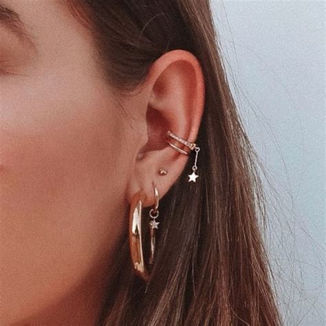 The Coolest Piercing Trends To Try This Year Cool Ear Piercings Ear