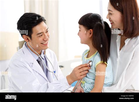 Asian Doctor Treating Child Hi Res Stock Photography And Images Alamy